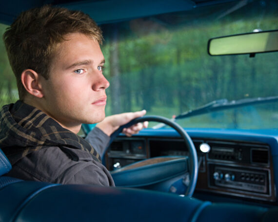 Teenage boy in car